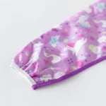 Bumkins Αδιάβροχη σαλιάρα με μακρυά μανίκια SLEEVED BIB UNICORNS